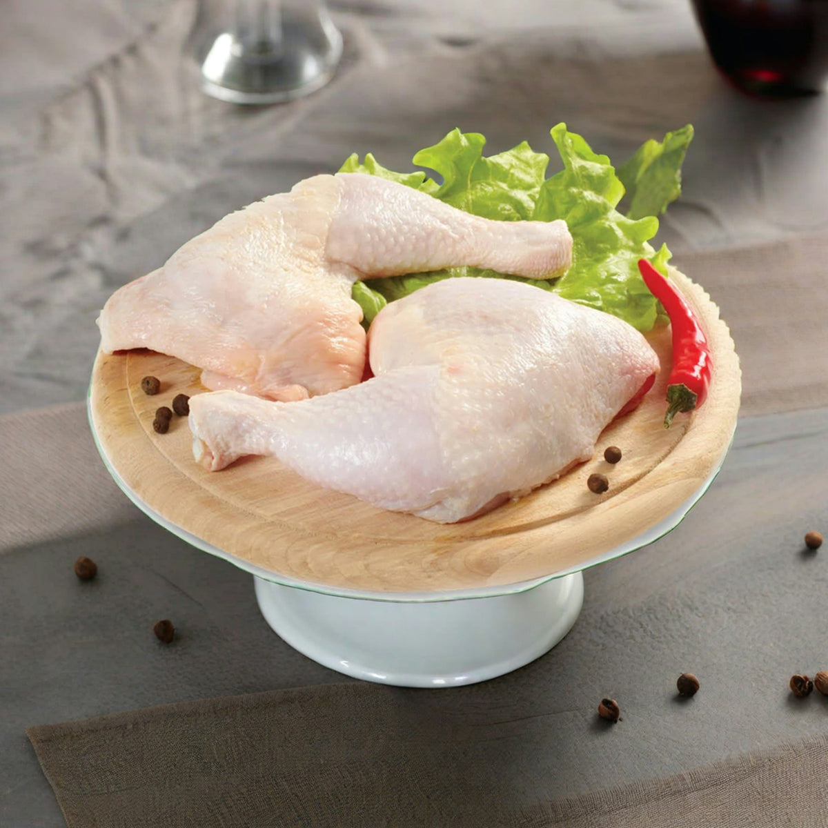 Raw chicken leg quarters (sample photo)